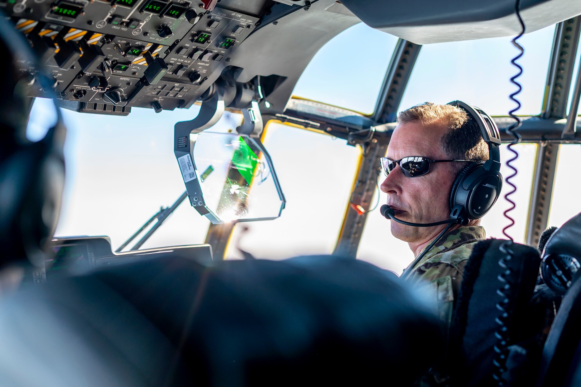 U.S. Air Force Brig. Gen. Christopher Sage, 332nd Air Expeditionary Wing commander, co-pilots an HC-130J Combat King II after a Forward Area Refueling Point (FARP) exercise August 2, 2021, at an undisclosed location somewhere in Southwest Asia. FARP training prepares Airmen to effectively refuel aircraft in austere locations when air-to-air refueling is not possible or when fueling stations are not accessible. (U.S. Air Force photo by Senior Airman Karla Parra)