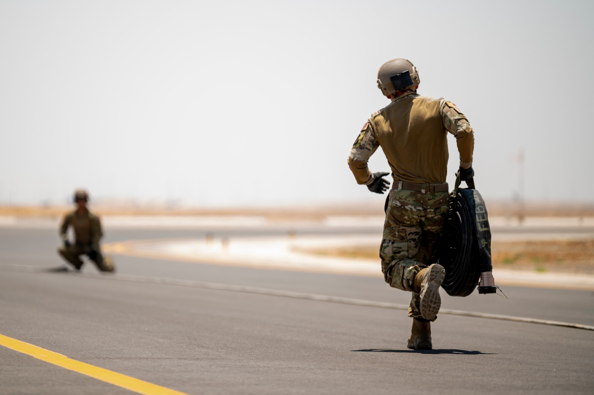 U.S. Airmen from the 26th Expeditionary Rescue Squadron set up a Forward Area Refueling Point (FARP) for two F-15E Strike Eagles August 2, 2021, at an undisclosed location somewhere in Southwest Asia. FARP training prepares Airmen to effectively refuel aircraft in austere locations when air-to-air refueling is not possible or when fueling stations are not accessible. (U.S. Air Force photo by Senior Airman Karla Parra)
