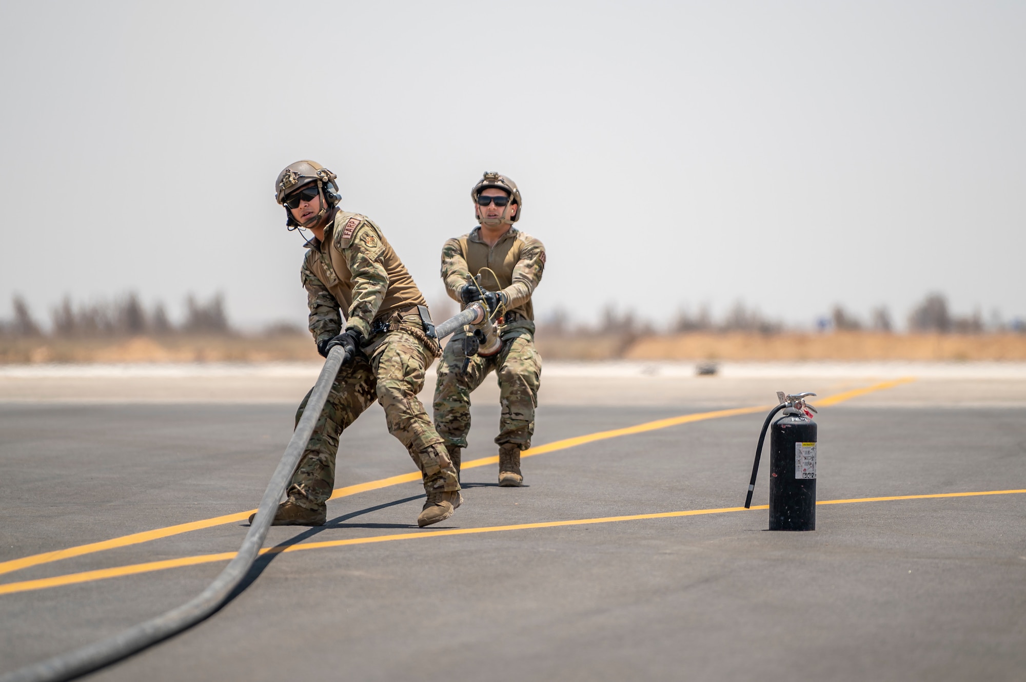 U.S. Airmen from the 26th Expeditionary Rescue Squadron set up a Forward Area Refueling Point (FARP) for two F-15E Strike Eagles August 2, 2021, at an undisclosed location somewhere in Southwest Asia. FARP training prepares Airmen to effectively refuel aircraft in austere locations when air-to-air refueling is not possible or when fueling stations are not accessible. (U.S. Air Force photo by Senior Airman Karla Parra)