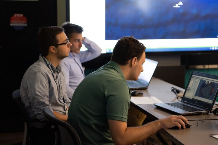 IMAGE: Participants of the Naval Surface Warfare Center Dahlgren Division Innovation Lab Wargaming Hackathon event compete against the other technical departments, July 27. The bootcamp portion included tutorials on modeling and simulation concepts. The afternoon session included surface warfare scenarios followed by increasingly more difficult scenarios where participants used their acquired M&S skills to defeat the enemy. The event provided an overview of Naval capabilities across all departments.