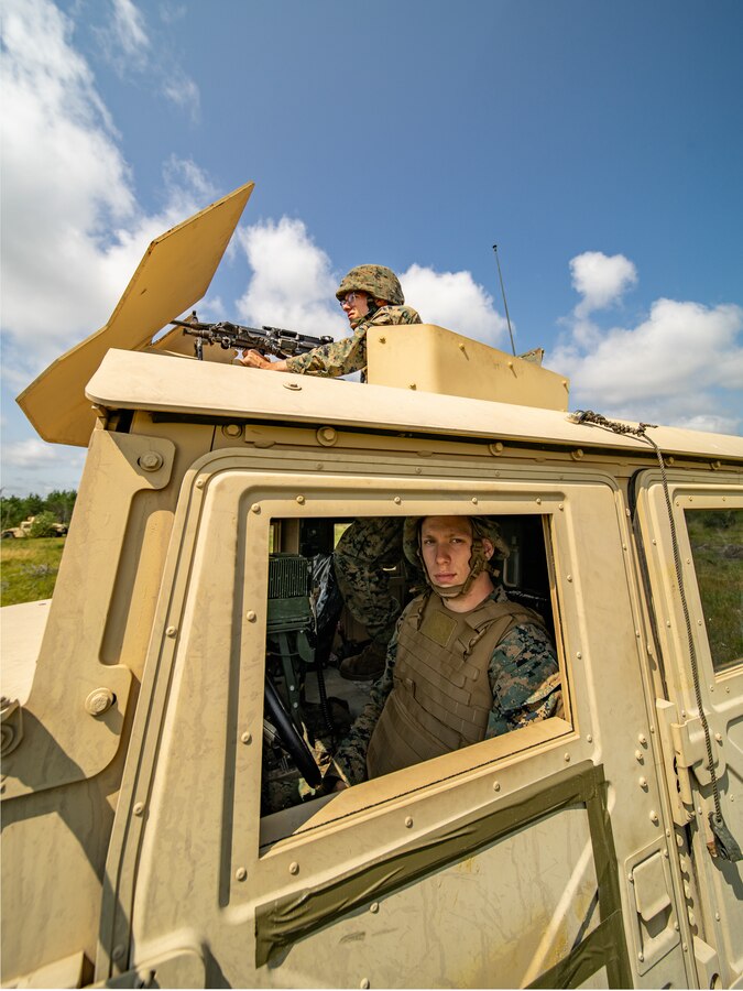 Marines with Combat Logistics Battalion (CLB) 451, 4th Marine Logistics Group, prepare to post security during a simulated improvised explosive device attack during Northern Strike 21-2 at Camp Grayling, Michigan on Aug. 10, 2021. Northern Strike is an annual exercise hosted by the National Guard aboard the National All-Domain Warfighting Center at Camp Grayling, MI. Reserve Marines with CLB 451 are providing direct and general support to Joint Task Force 85, increasing interoperability with sister services. (U.S. Marine Corps photo by Lance Cpl. Colby Bundy)