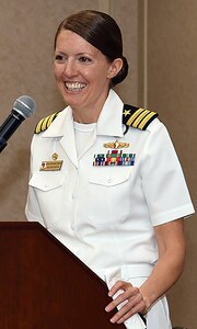 Cmdr. Stephanie Simoni speaks to Sailors