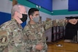 Pennsylvania Air National Guard (PAANG) commander, Brig. Gen. Michael Regan, tours an Innovative Readiness Training (IRT) site in Dover, Delaware, with officer-in-charge Army Capt. Nicholas Mollica on Aug. 2, 2021.