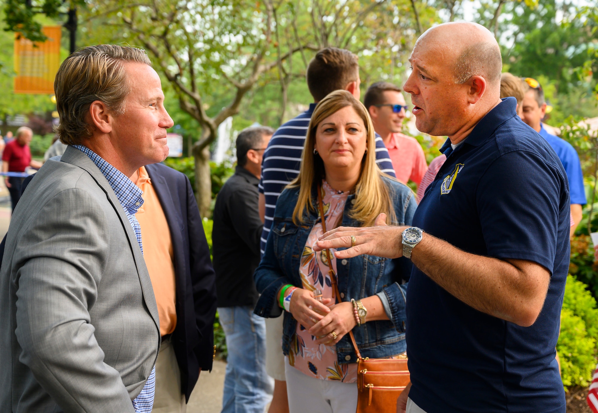 Col. Patrick Miller (right), 88th Air Base Wing and Wright-Patterson Air Force Base commander, alongside his wife, Beth, visits with Ohio Lt. Gov. Jon Husted at a reception prior to the Dayton Development Coalition’s Hometown Heroes event Aug. 5, 2021, at Fraze Pavilion in  Kettering, Ohio. (U.S. Air Force photo by R.J. Oriez)