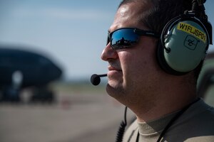 Tech. Sgt. Jorge Padron, 911th Aircraft Maintenance Squadron crew chief, observes and talks to fellow Airmen while inspecting a C-17 Globemaster III engine during Operation Steel Moose ’21 at the Pittsburgh International Airport Air Reserve Station, Pennsylvania, Aug. 5, 2021. Airmen assigned to the 911th AMXS prepare aircraft to prove they can provide mission ready aircraft.