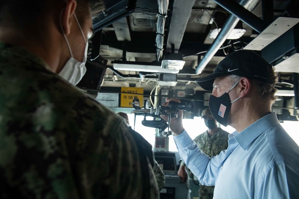 U.S. Ambassador to Egypt, Jonathan R. Cohen, looks through a sextant.