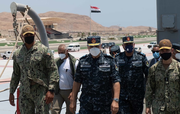 Capt. Joseph Baggett, commanding officer of guided-missile cruiser USS Monterey (CG 61), left, Vice Adm. Ahmed Khaled Hassan Saeed, commander of the Egyptian Naval Force, center, and Vice Adm. Brad Cooper, commander of U.S. Naval Forces Central Command (NAVCENT), U.S. 5th Fleet and Combined Maritime Forces (CMF), far right, walk together during a tour of the ship.