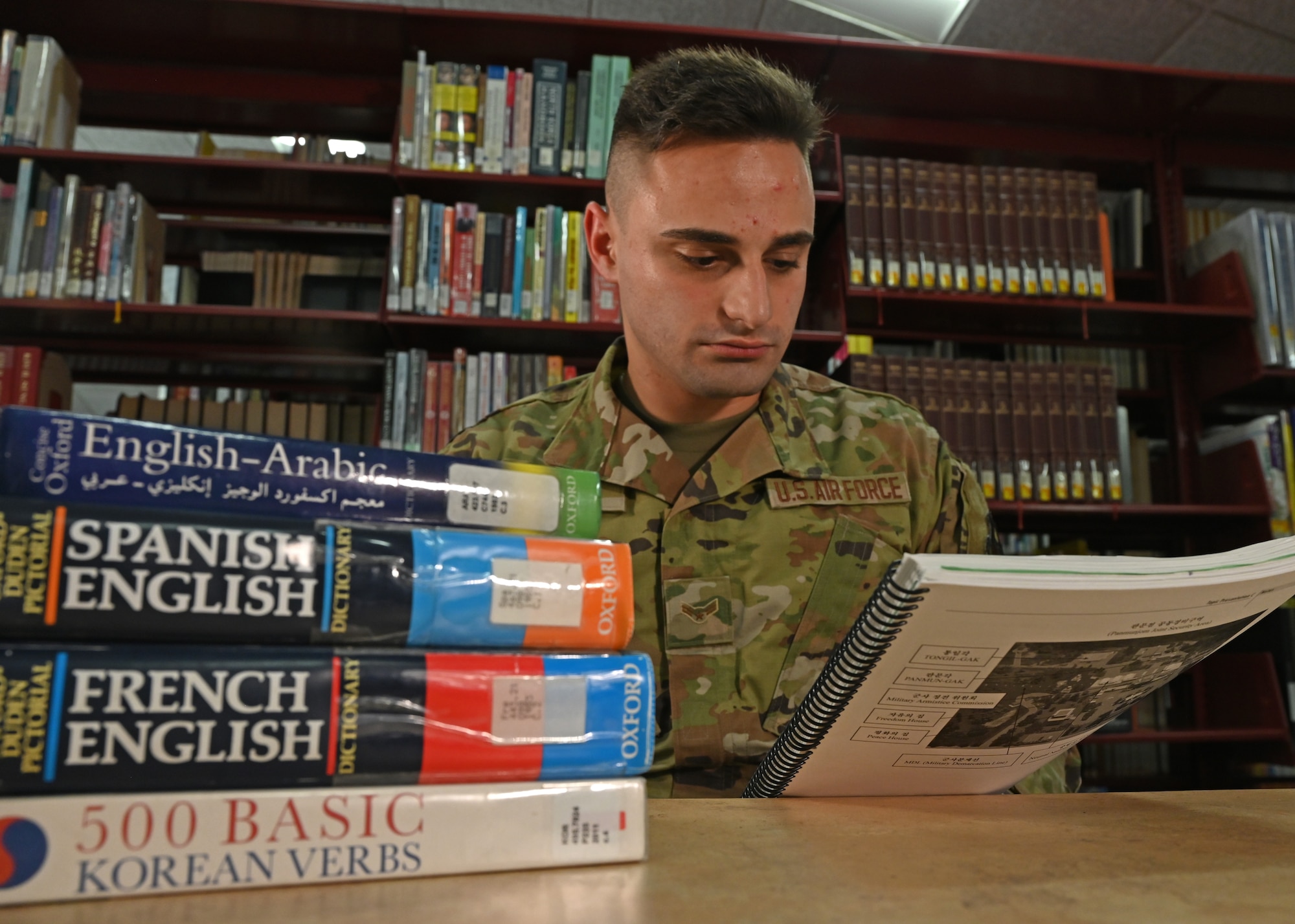U.S. Air Force Airman 1st Class Omar Jazaerle, 314th Training Squadron student, reads the curriculum for class at the Presidio of Monterey, California, July 21, 2021. Jazaerle can speak three languages and is currently learning Korean as his fourth language at the Defense Language Institute Foreign Language Center. (U.S. Air Force photo by Senior Airman Michael Bowman)
