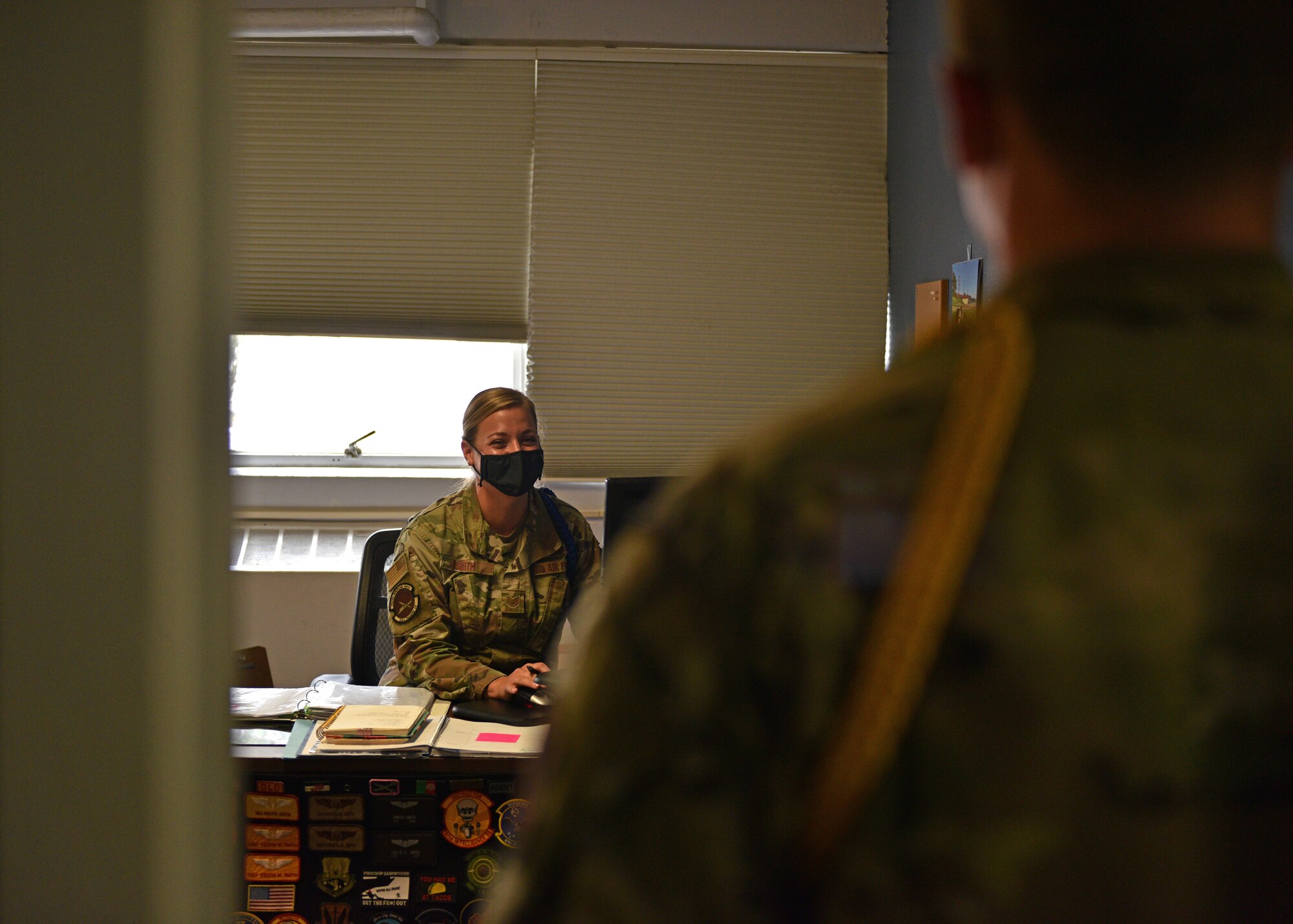 U.S. Air Force Tech. Sgt. Krista Smith, 314th Training Squadron military training leader, speaks to a student on the Presidio of Monterey, California, July 22, 2021. MTLs are responsible for teaching military and physical training while acting as a frontline supervisor to the students. (U.S. Air Force photo by Senior Airman Ashley Thrash)