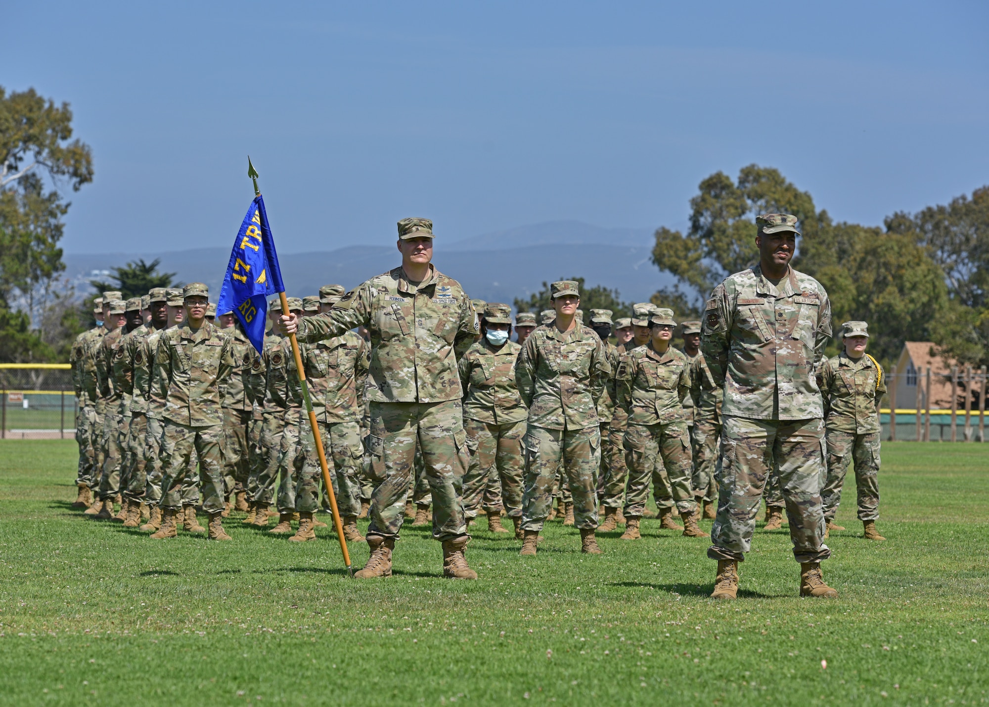 Members of the 517th Training Group stand in formation during the 517th TRG change of command ceremony at the Presidio of Monterey, California, July 23, 2021. More than 100 representatives from the Defense Language Institute Foreign Language Center and the Presidio of Monterey attended the change of command to welcome incoming commander, Col. Jennifer Saraceno. (U.S. Air Force photo by Senior Airman Ashley Thrash)