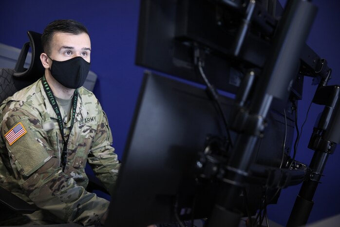 A U.S. Cyber Command member works to defend the nation in cyberspace at Fort George G. Meade, Md., Oct. 28, 2020.
