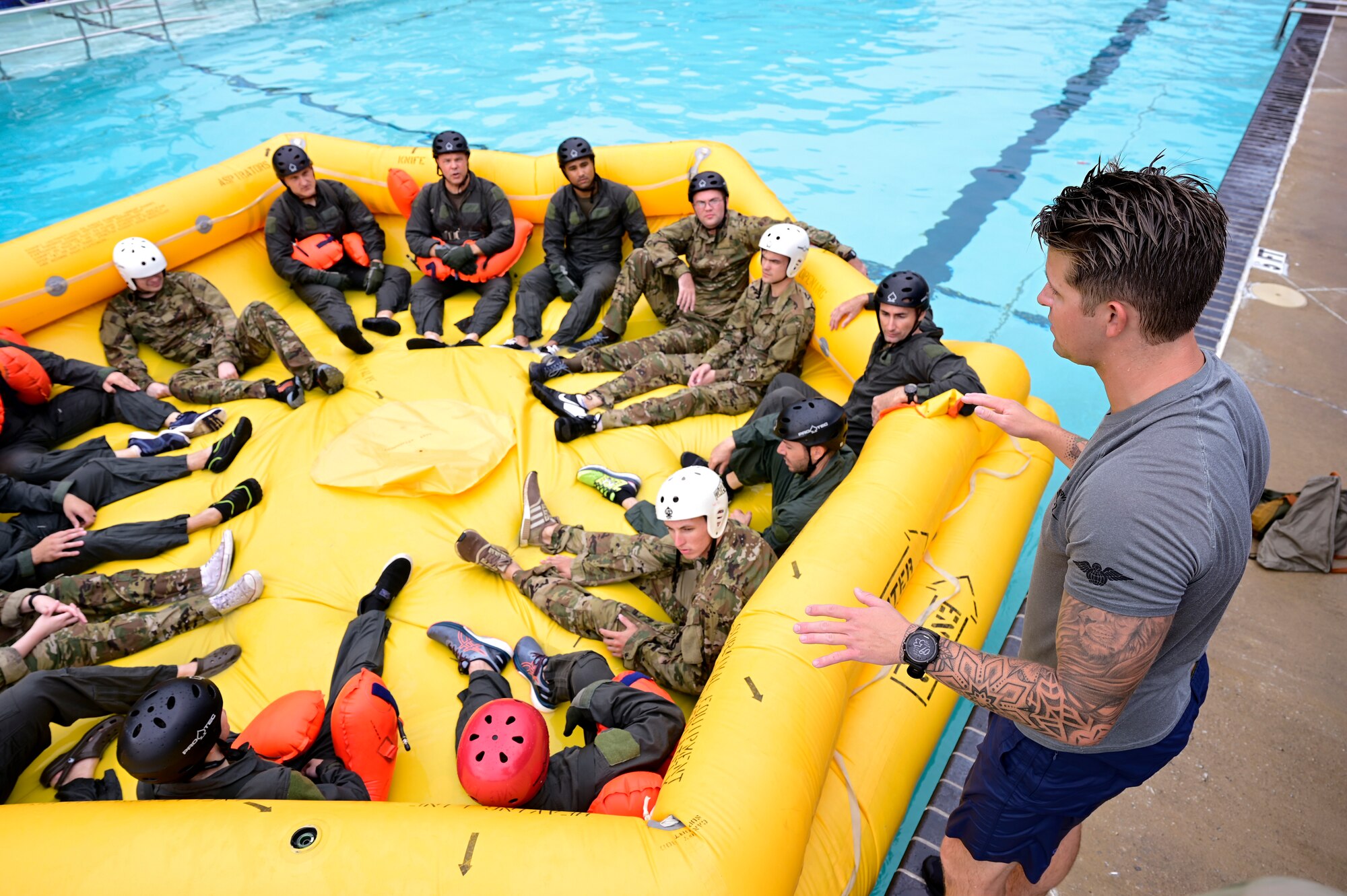 An instructor talks to students in a raft.