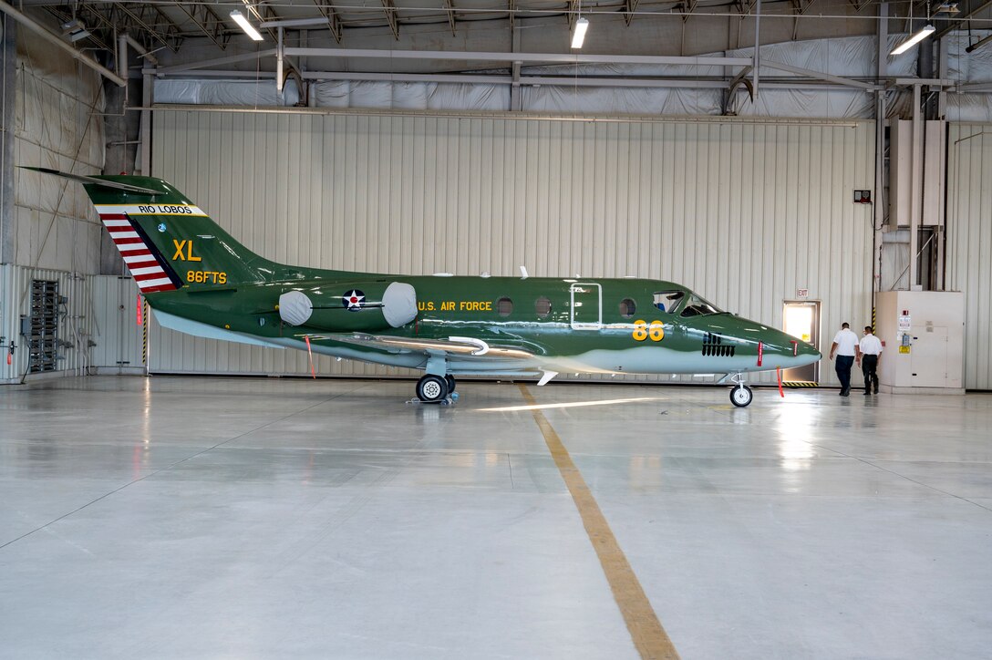 The new heritage tail of the 86th Flying Training Squadron sits prior to an unveiling ceremony August 13, 2021 at Laughlin Air Force Base, Texas. The paint scheme of the aircraft reaches back to the Douglas B-18 “Bolo” of World War II and honors the Airmen who served aboard, the nose of the aircraft is also inscribed with Capt. Glen Edward’s name in memory of his service to the U.S. Air Force. (U.S. Air Force Photo by Senior Airman Nicholas Larsen)
