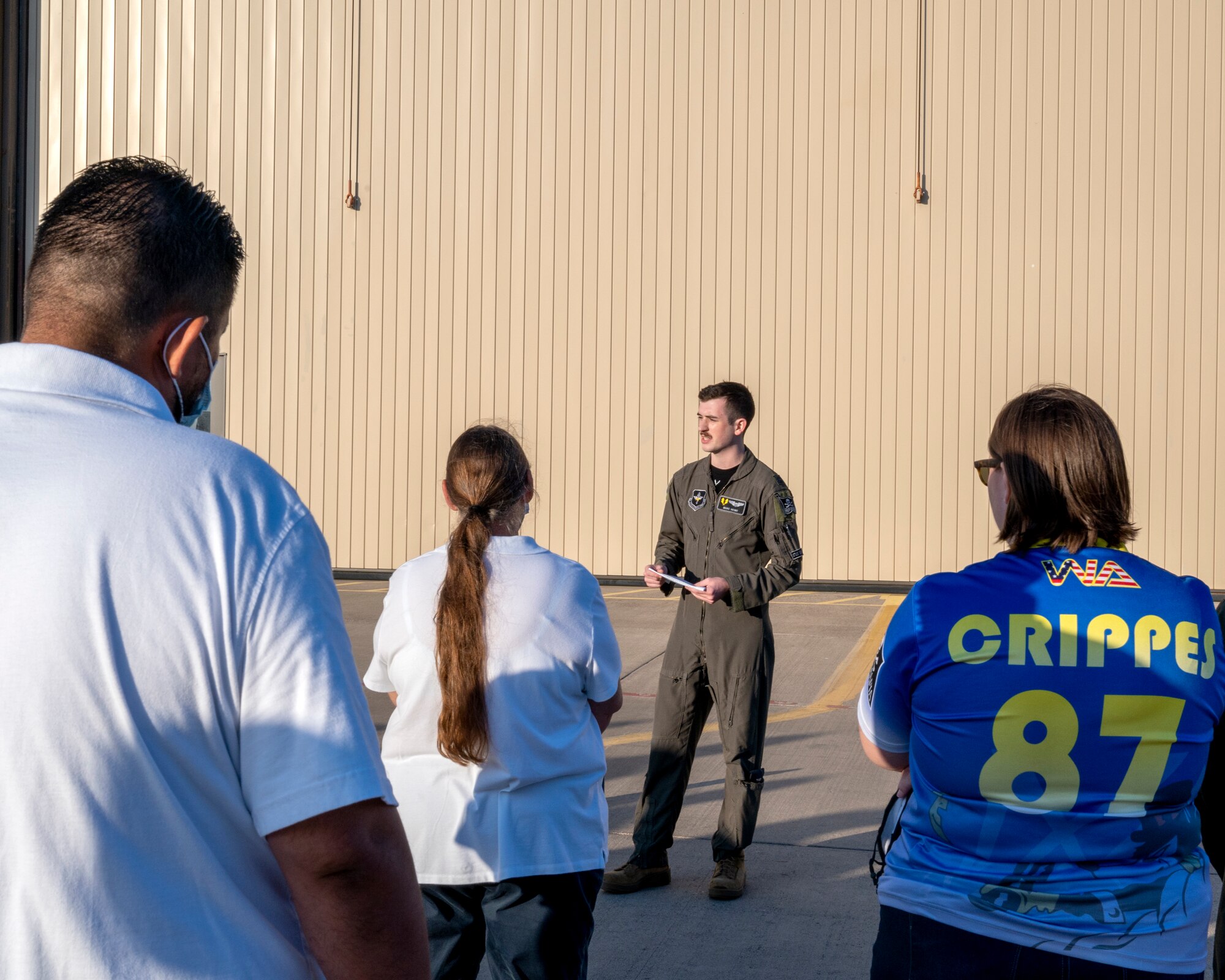 U.S. Air Force Capt. Marc Howe, 86th Flying Training Squadron flight commander, speaks to a crowd before the unveiling of the new 86th FTS heritage tail on August 13, 2021 at Laughlin Air Force Base, Texas. Capt. Howe spoke about how this aircraft honored both the airmen who came before and would serve after the painting of this plane. (U.S. Air Force Photo by Senior Airman Nicholas Larsen)