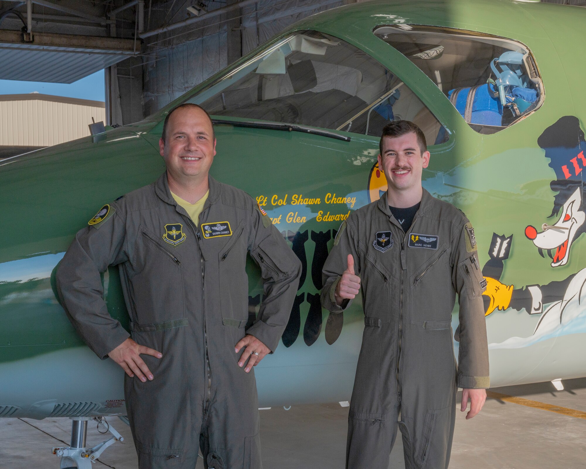U.S. Air Force Lt. Col. Shawn Chaney, 86th Flying Training Squadron commander, and U.S. Air Force Capt. Marc Howe, 86th Flying Training Squadron flight commander, Smile in front of the recently completed heritage tail at Laughlin Air Force Base, Texas on August 13, 2021. The paint scheme of the aircraft reaches back to the Douglas B-18 “Bolo” of World War II and the nose of the aircraft is also inscribed with Capt. Glen Edward’s name in memory of his service to the U.S. Air Force. (U.S. Air Force Photo by Senior Airman Nicholas Larsen)