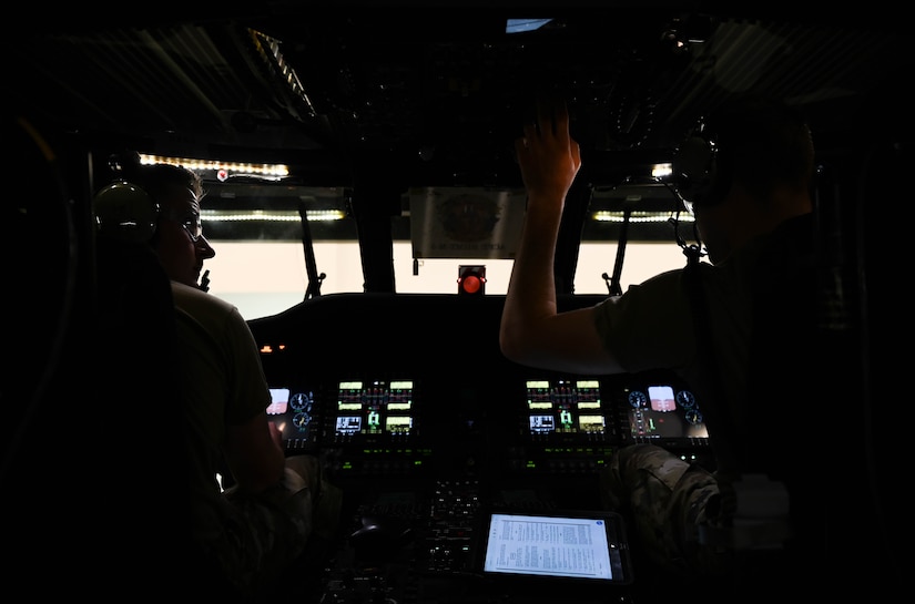 U.S. Air Force Airmen, assigned to the 362nd Training Squadron, Detachment One, perform maintenance checks in the cockpit of a Sikorsky UH-60 Black Hawk helicopter, simulator at Joint Base Langley-Eustis, Virginia, July 16, 2021. During the Helicopter and tiltrotor maintenance course, students learn different maintenance skill sets through 15 training blocks. (U.S. Air Force photo by Senior Airman Sarah Dowe)