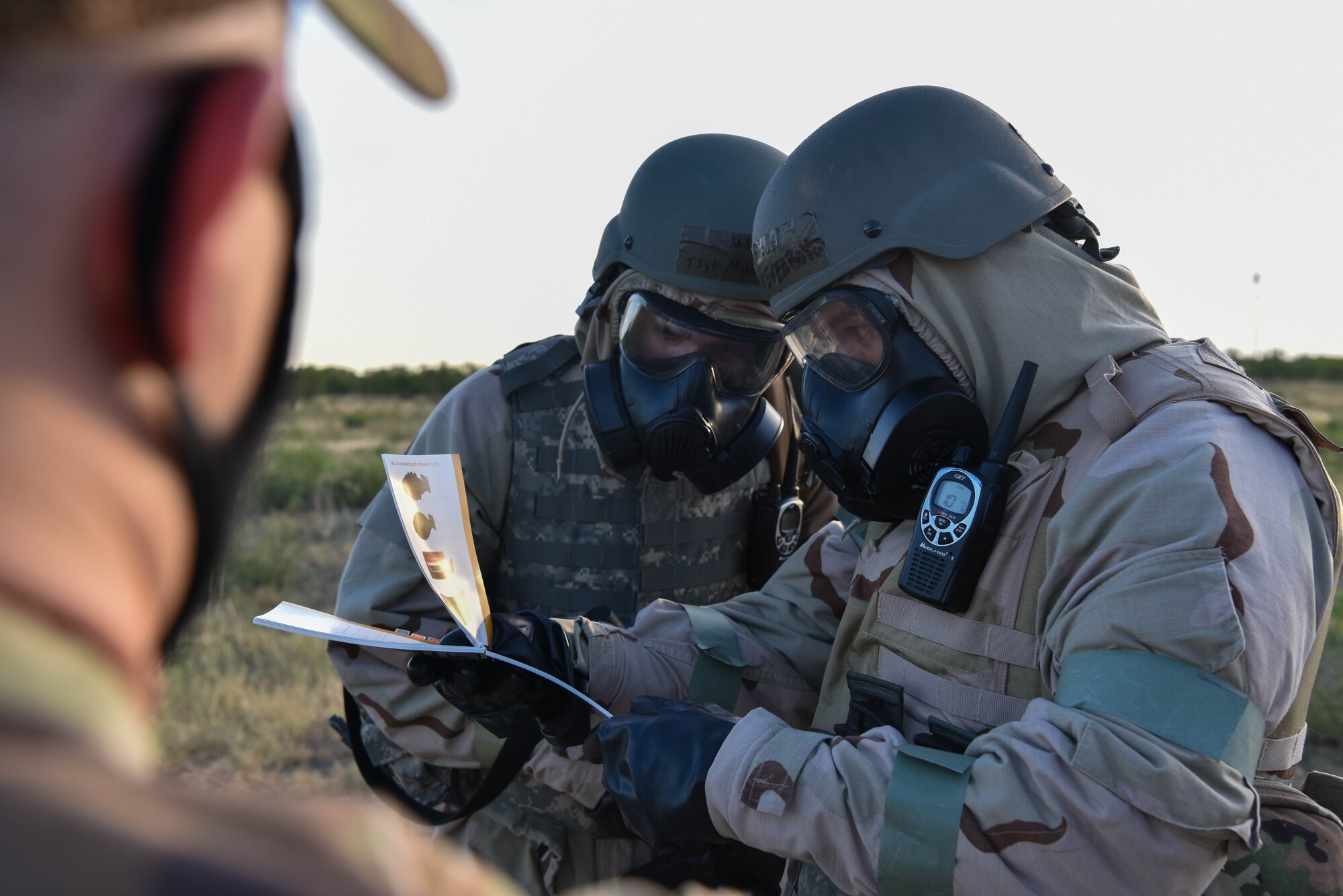 U.S. Air Force Tech. Sgt. Steven Boyd, 315th Training Squadron instructor, and Tech. Sgt. Mike Lowry, 315th TRS instructor, review training materials during the Expeditionary Readiness Training exercise on Goodfellow Air Force Base, Aug. 13, 2021. During the exercise, ERT members were evaluated on how they completed a variety of tasks. (U.S. Air Force photo by Senior Airman Jermaine Ayers)