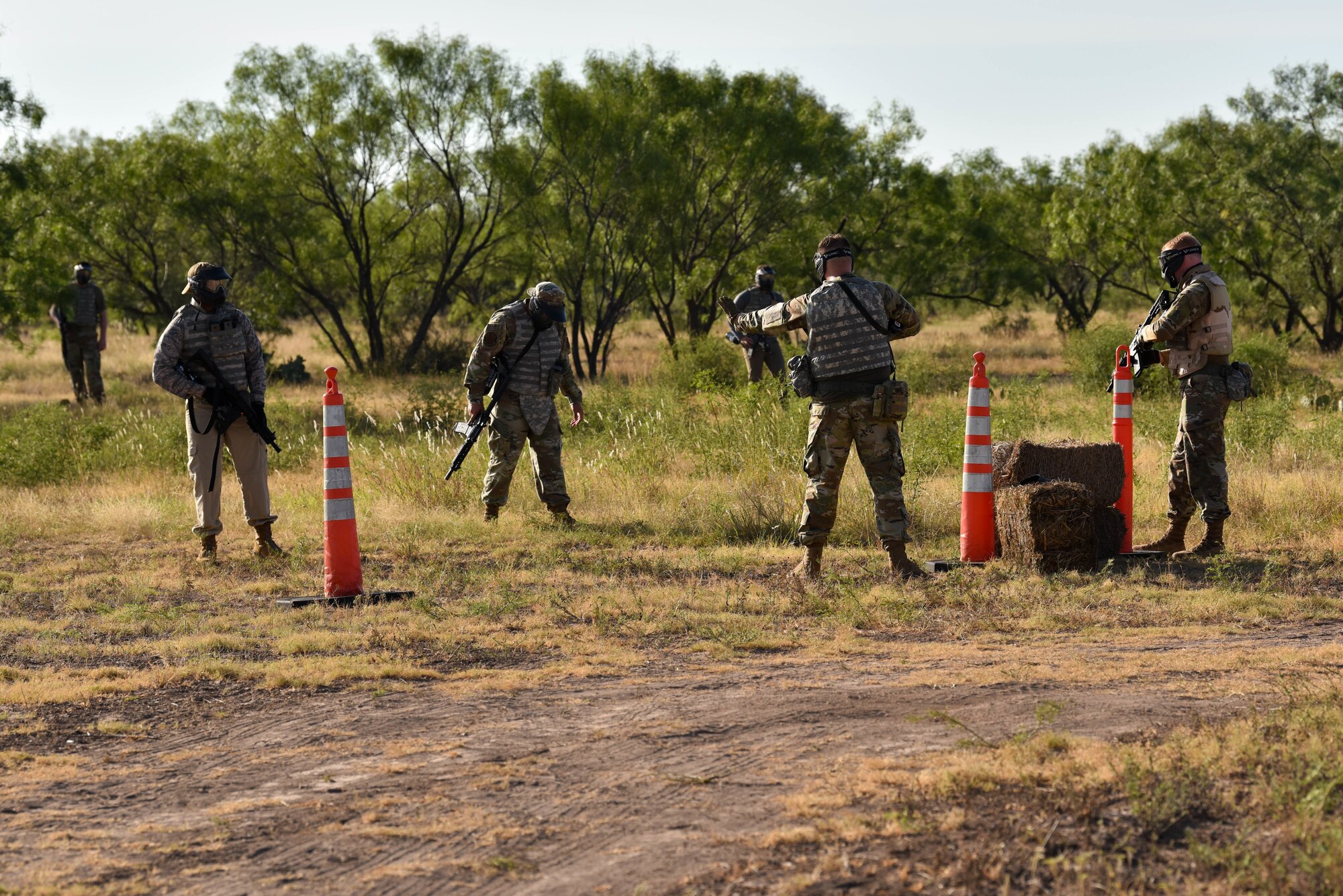U.S. Air Force 17th Training Wing members assess opposition forces during the Expeditionary Readiness Training exercise on Goodfellow Air Force Base, Aug. 13, 2021. During the exercise, ERT members were tasked with determining threat levels near a perimeter in a simulated training environment. (U.S. Air Force photo by Senior Airman Jermaine Ayers)