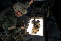 U.S. Marines with 3rd Radio Battalion conduct helicopter rope suspension techniques from a CH-53E Super Stallion attached to Marine Heavy Helicopter Squadron 463, Landing Zone Eagle, Marine Corps Base Hawaii, Aug. 6, 2021. As a host platform to all elements of the Marine Air Ground Task Force, MCBH provides the necessary environment to produce readiness in the air, on land and at sea. (U.S. Marine Corps photo by Lance Cpl. Samantha Sanchez)