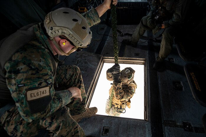 U.S. Marines with 3rd Radio Battalion conduct helicopter rope suspension techniques from a CH-53E Super Stallion attached to Marine Heavy Helicopter Squadron 463, Landing Zone Eagle, Marine Corps Base Hawaii, Aug. 6, 2021. As a host platform to all elements of the Marine Air Ground Task Force, MCBH provides the necessary environment to produce readiness in the air, on land and at sea. (U.S. Marine Corps photo by Lance Cpl. Samantha Sanchez)