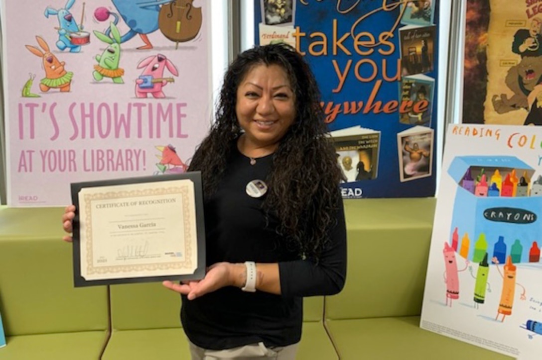 Vanessa Tzorin-Stacy, lead Library Technician earns Employee of the Quarter for her hard work and selfless performance at the Library, McTureous Hall, aboard Marine Corps Logistics Base Barstow, California, July 29. Tzorin-Stacy is widely known for going above and beyond the call of duty for the military personnel, their families, and the civilians on base. (Photo courtesy of Robert Harris, Marine and Family Programs manager)