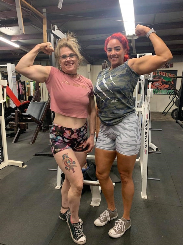 Brooke Verrill and Michelle Lawing show off their muscles after a workout at Animal House Gym, Barstow, California, July 23. The two are coached by James Seifert, Giant Killer Fitness, and recently broke personal records at the Rise of the Valkyrie, all-women’s powerlifting meet hosted by Iron Monger’s Gym in Vista, California and are headed to the World Championships! (Photo courtesy of James Seifert)