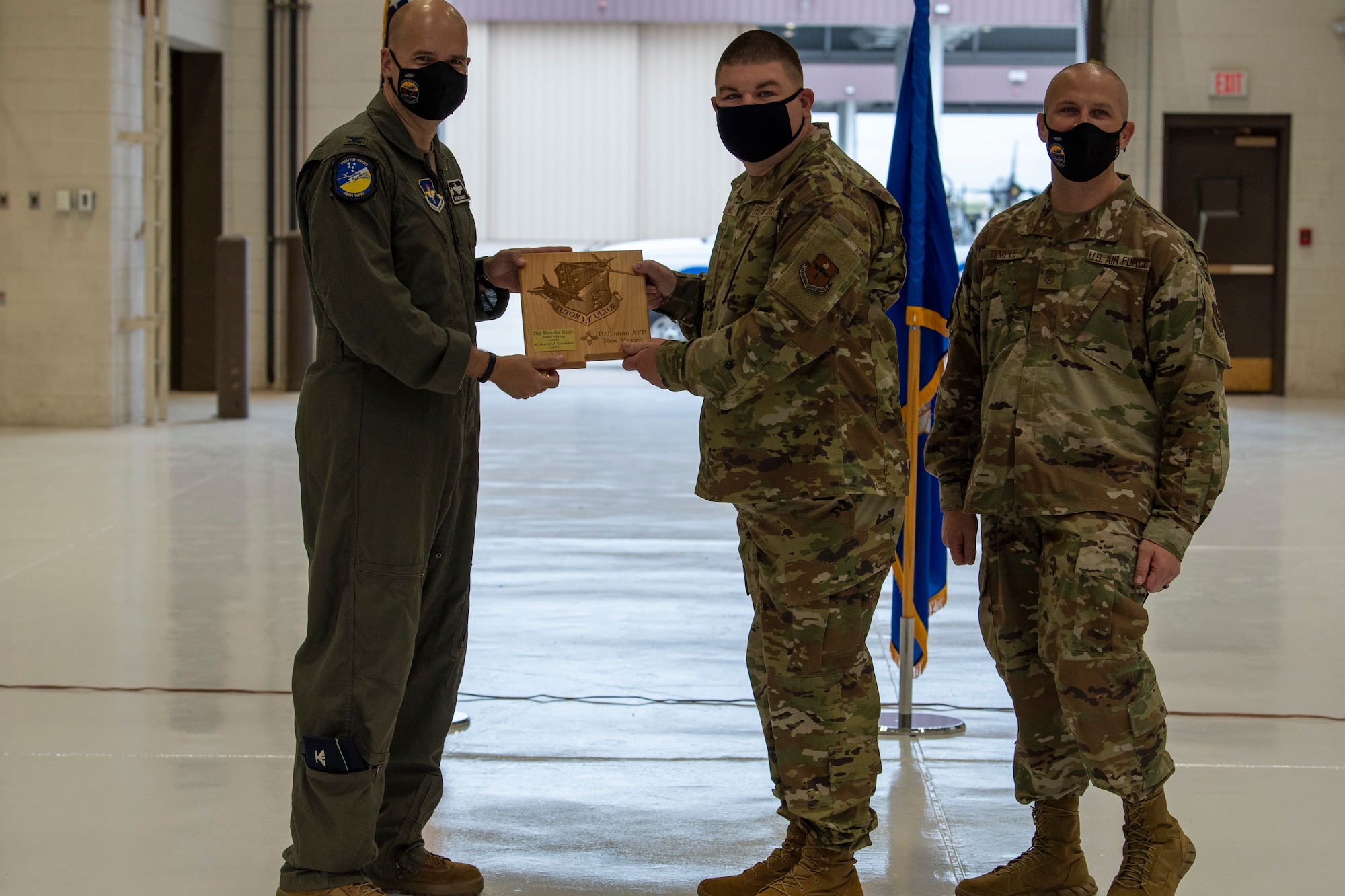 Tech Sgt. Alexander Manco, quarterly award winner, accepts the Noncommissioned officer of the quarter award during the 49th Wing’s 2nd quarter award ceremony, Aug. 13, 2021, on Holloman Air Force Base, New Mexico. Quarterly award winners were selected based on their technical expertise, demonstration of leadership and job performance. (U.S. Air Force photo by Airman 1st Class Jessica Sanchez)