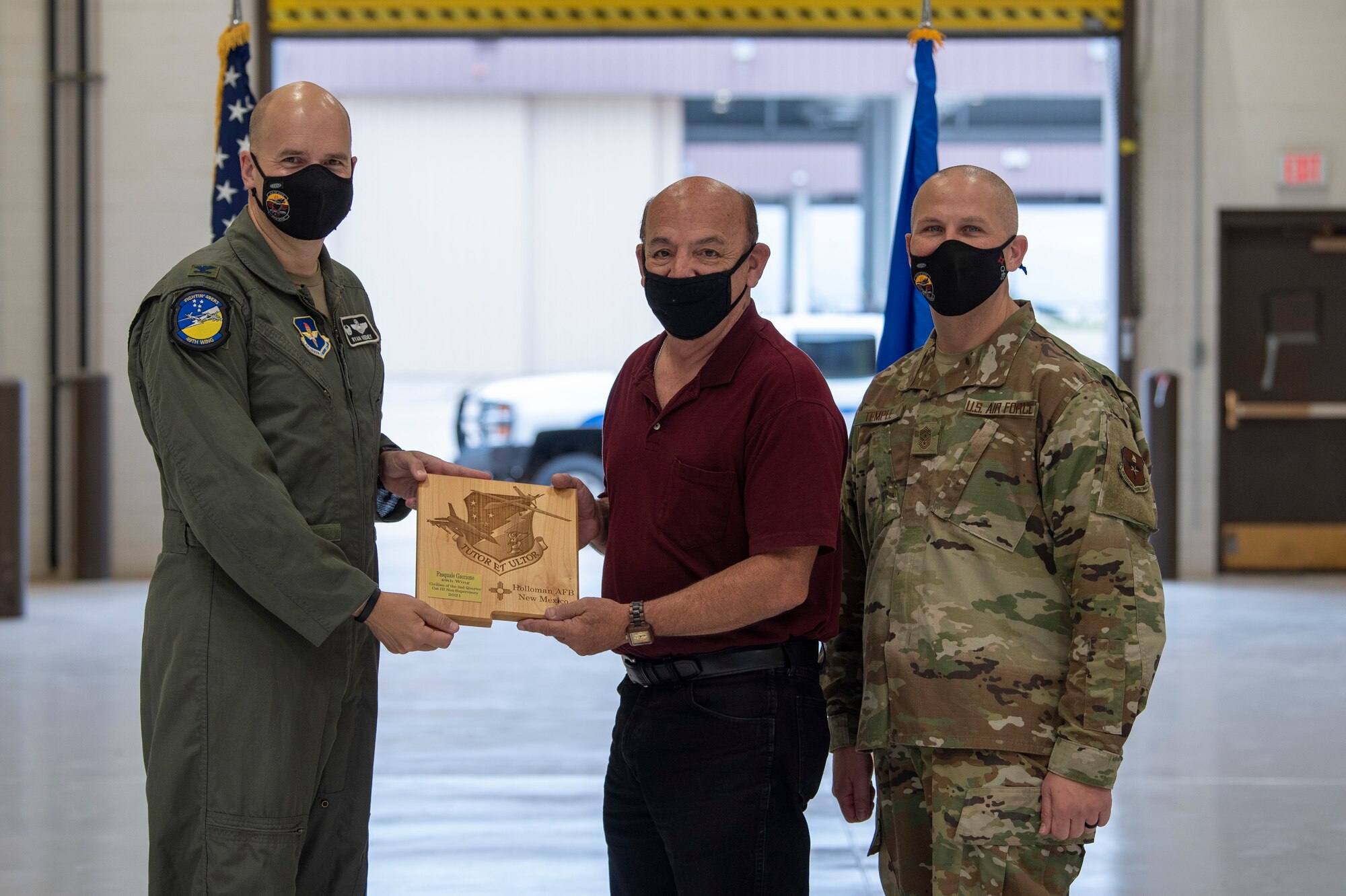 Pasquale Gaccione, quarterly award winner, accepts the Civilian Category III Non-Supervisory of the quarter award during the 49th Wing’s 2nd quarter award ceremony, Aug. 13, 2021, on Holloman Air Force Base, New Mexico. Quarterly award winners were selected based on their technical expertise, demonstration of leadership and job performance. (U.S. Air Force photo by Airman 1st Class Jessica Sanchez)