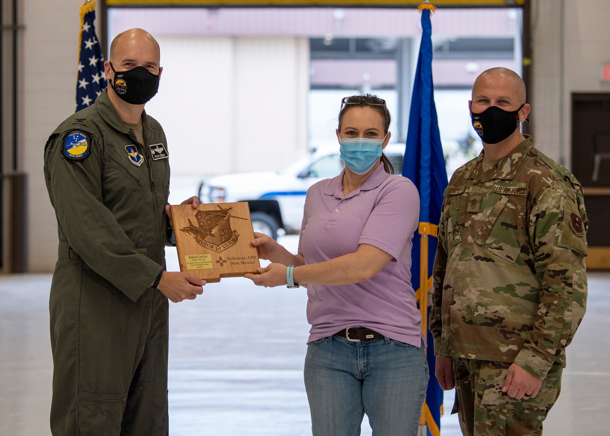 Kimberly Lawhorn, quarterly award winner, accepts the Civilian Category III Supervisory of the quarter award during the 49th Wing’s 2nd quarter award ceremony, Aug. 13, 2021, on Holloman Air Force Base, New Mexico. Quarterly award winners were selected based on their technical expertise, demonstration of leadership and job performance. (U.S. Air Force photo by Airman 1st Class Jessica Sanchez)