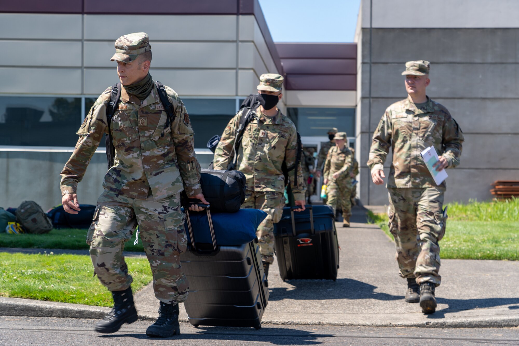Senior Master Sgt. Joshua Pousson, 142nd Maintenance Group, leads a group of Oregon National Guard Airmen departing Portland Air National Guard Base in support of OPLAN Smokey. OPLAN Smokey requires Airmen to be ready at a moment’s notice to help with statewide wildfire relief efforts.