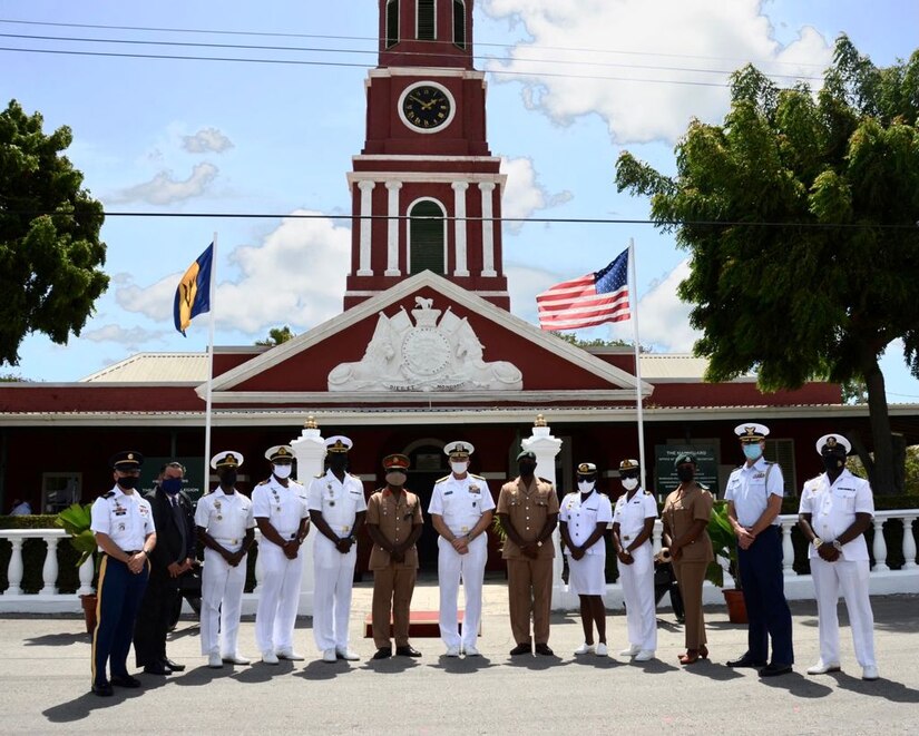 U.S. Navy Adm. Craig S. Faller poses for a photo with Barbados Defence Force staff and leaders at the historic Main Guard House on the Garrison Savannah in Barbados