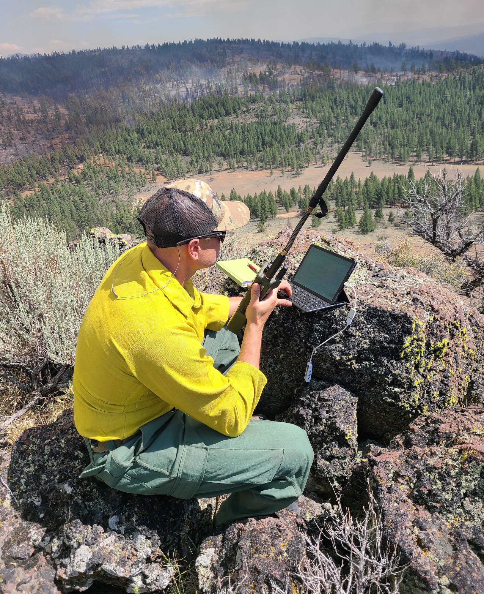 Master Sgt. Brent Hill, Pennsylvania Air National Guard, controls the infrared imagery on an RC26 in support of burn operations on the Beckwourth Fire in California from western Nevada July 13, 2021. Hill is part of a team of imagery experts providing live aerial video streaming to fire bosses working on the front lines of the California wildfires.
