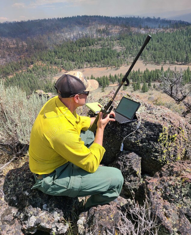 Master Sgt. Brent Hill, Pennsylvania Air National Guard, controls the infrared imagery on an RC26 in support of burn operations on the Beckwourth Fire in California from western Nevada July 13, 2021. Hill is part of a team of imagery experts providing live aerial video streaming to fire bosses working on the front lines of the California wildfires.
