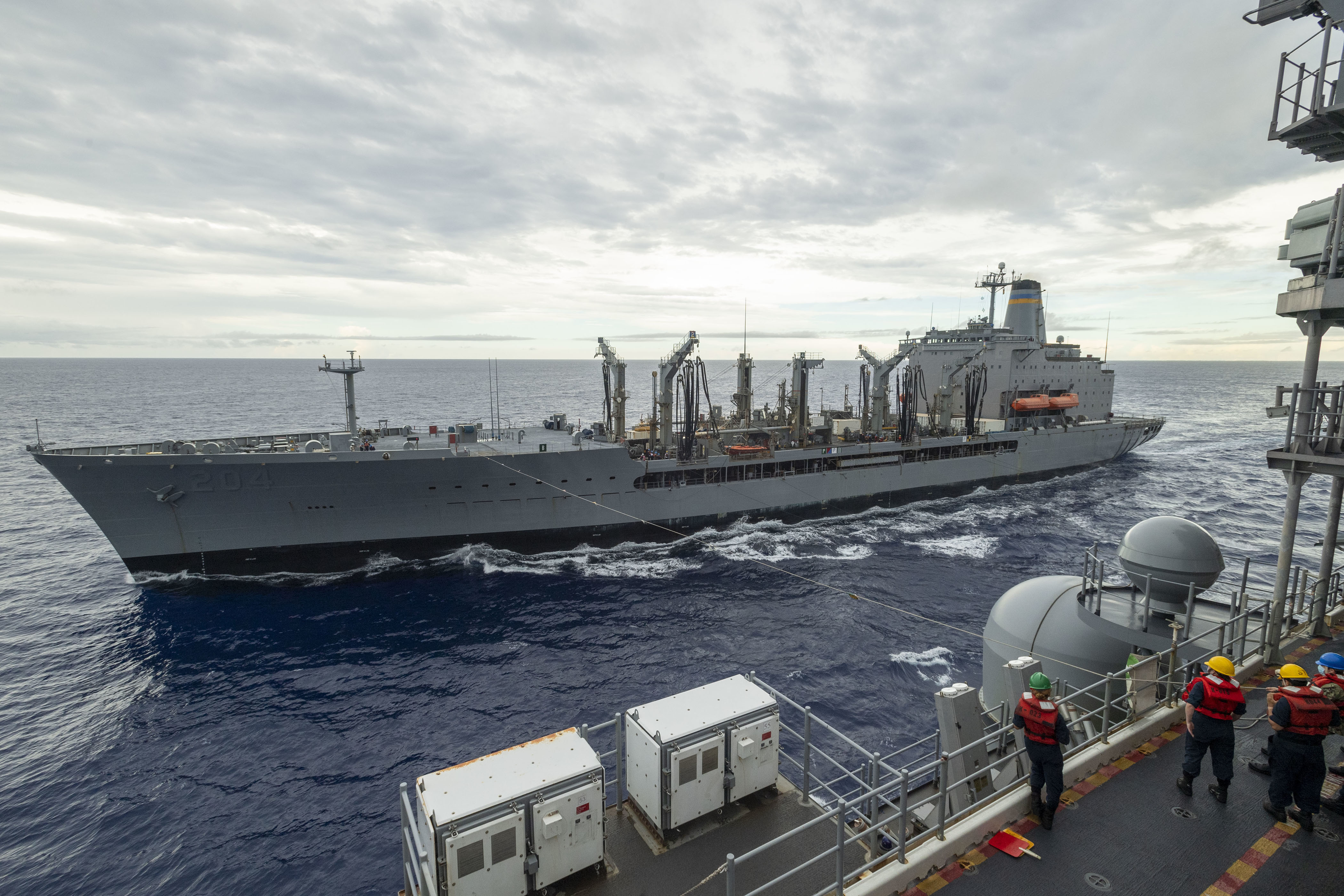 USS America (LHA 6) conducts a replenishment-at-sea with the fleet replenishment oiler USNS Rappahannock (T-AO 204).