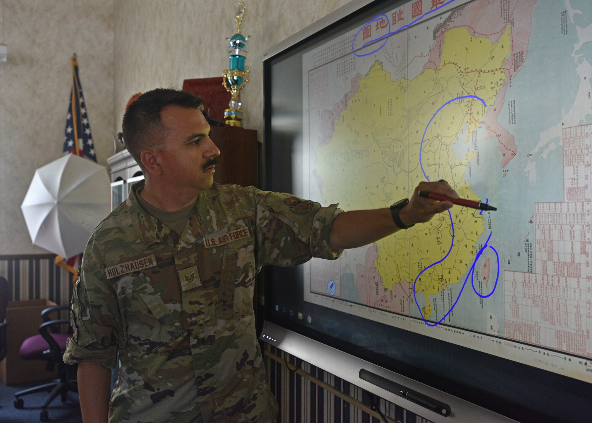 U.S. Air Force Staff Sgt. Uruwishi Holzhausen, 314th Training Squadron military language instructor, discusses the geography of China on the Presidio of Monterey, California, July 21, 2021. Holzhausen learned Chinese mandarin when he was a student at the Defense Language Institute Foreign Language Center. (U.S. Air Force photo by Senior Airman Ashley Thrash)