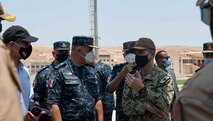 210812-N-WQ732-1071 BERENICE, Egypt (August 12, 2021) – U.S. Ambassador to Egypt, Jonathan Cohen, left, Vice Adm. Ahmed Khaled Hassan Saeed, commander of the Egyptian Naval Force, center, and Vice Adm. Brad Cooper, commander of U.S. Naval Forces Central Command (NAVCENT), U.S. 5th Fleet and Combined Maritime Forces (CMF), speak on the flight deck of guided-missile cruiser USS Monterey (CG 61) during a tour of the ship in Berenice, Egypt, Aug. 12. Monterey is deployed to the U.S. 5th Fleet area of operations in support of naval operations to ensure maritime stability and security in the Central Region, connecting the Mediterranean and Pacific through the western Indian Ocean and three strategic choke points. (U.S. Navy photo by Mass Communication Specialist Seaman Chelsea Palmer)