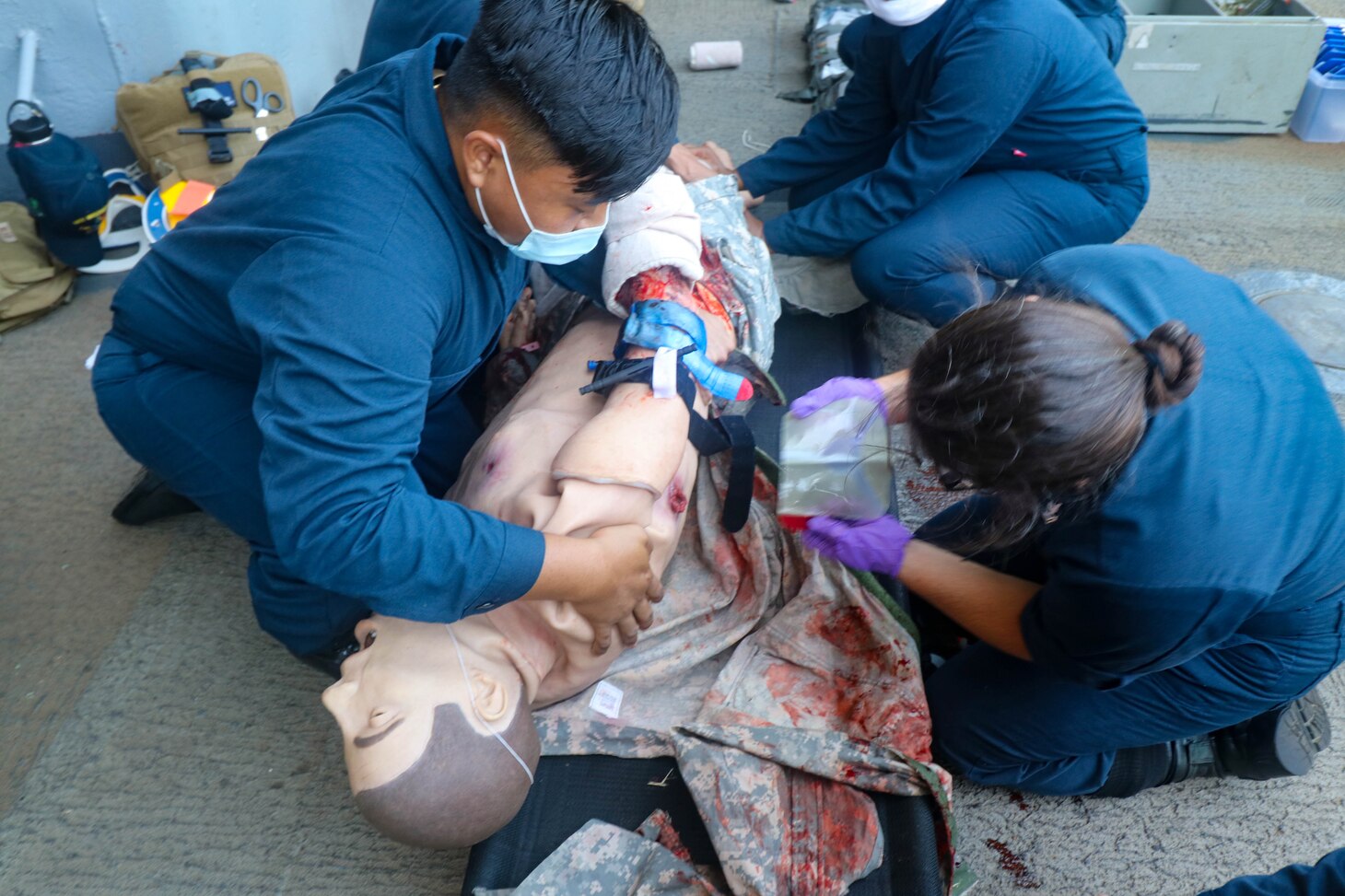 NAVAL STATION NORFOLK (Aug. 14, 2021) –Sailors provide medical aid to a crash dummy during a mass casualty drill aboard the dock landing ship USS Whidbey Island (LSD 41), the lead ship of its class of the same name, in support of Large Scale Exercise (LSE) 2021. LSE 2021 demonstrates the Navy's ability to employ precise, lethal, and overwhelming force globally across three naval component commands, five numbered fleets, and 17 time zones. (U.S. Navy photo by Ens. Drew Hendricks)