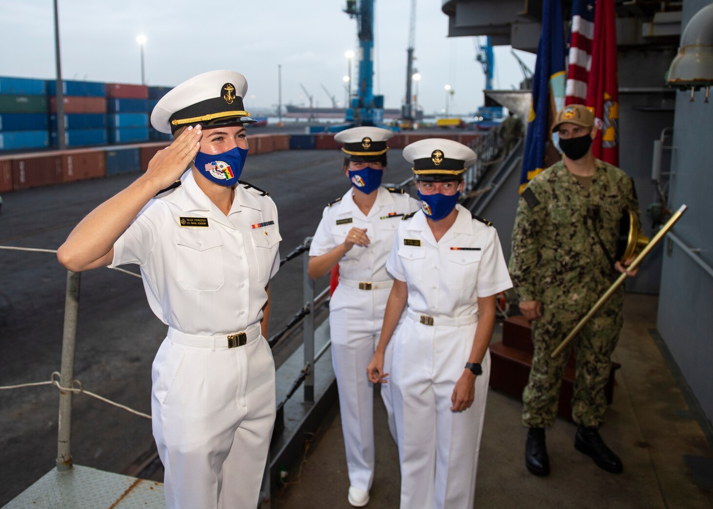 Midn. Taylor Forrester, left, salutes the commanding officer of the Expeditionary Sea Base Hershel "Woody" Williams (ESB 4) before departing the ship, Aug. 13, 2021.