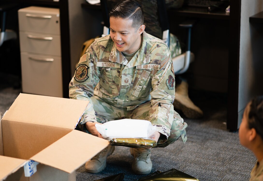 U.S. Air Force Master Sgt. John Stegen, assigned to the 187th Aeromedical Evacuation Squadron, Wyoming National Guard, unboxes medical supplies on July 11, 2021, Cheyenne, Wyo. MSgt Stegan has been selected as the Air National Guard First Sergeant of the Year for 2020. (U.S. Air National Guard photo by Senior Airman Sean Papile)