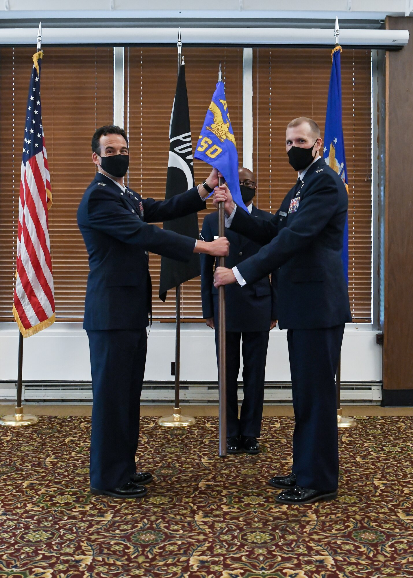 Col. Robert Lance accepts the guidon for the Test Support Division, Arnold Engineering Development Complex, from Col. Jeffrey Geraghty, AEDC commander, and assumes leadership of the division during a ceremony, Aug. 6, 2021, at Arnold Lakeside Complex at Arnold Air Force Base, Tenn. (U.S. Air Force photo by Jill Pickett)