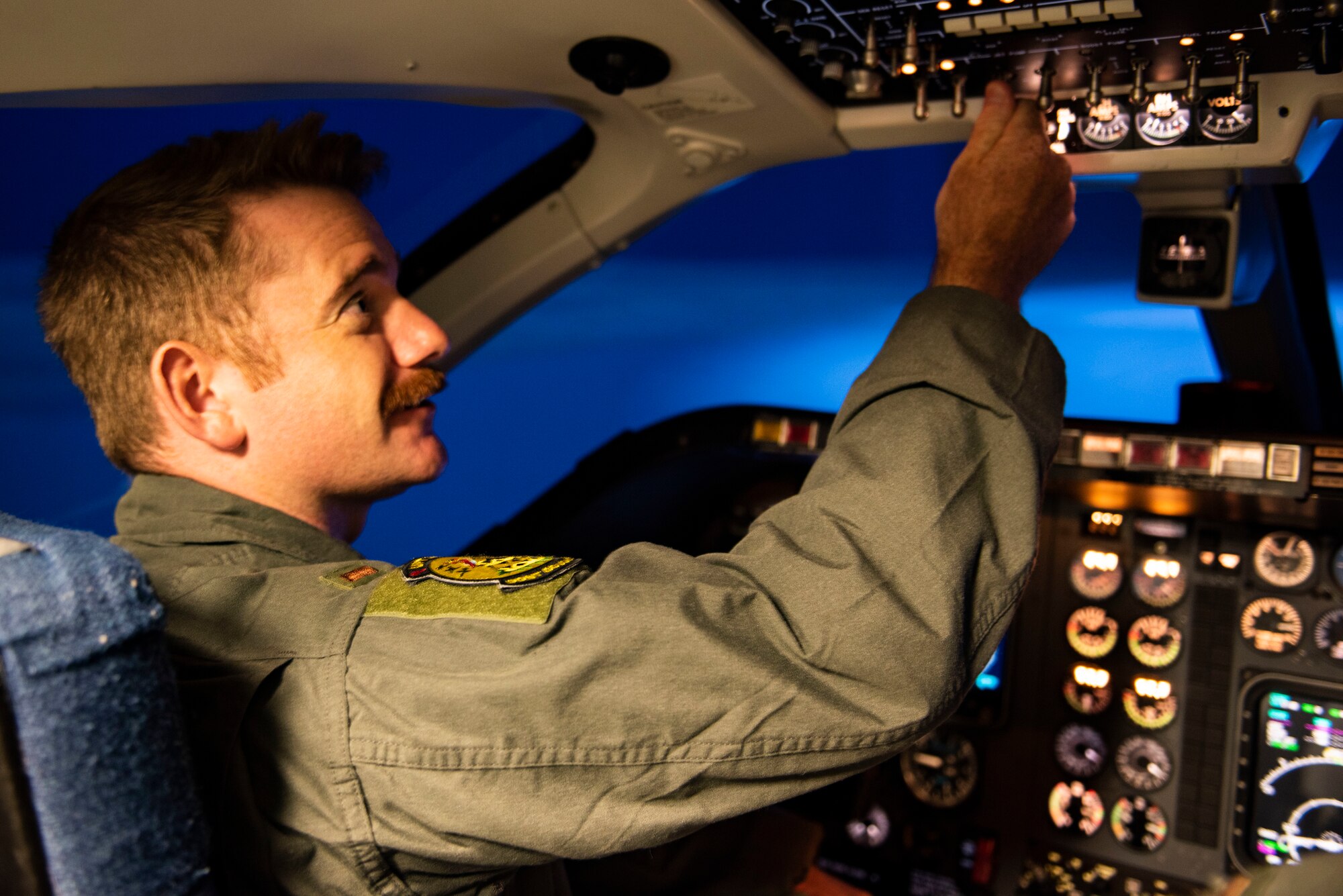 2nd Lt. John Jackson, 47th Flying Training Wing student pilot, straps into his seat and prepares for a simulated T-1 Jayhawk flight at Laughlin Air Force Base, Texas on Jul. 19, 2021. The simulators are state of the art equipment that can replicate any environment or situation that they may face when piloting the aircraft. (U.S. Air Force photo by Airman 1st Class David Phaff)