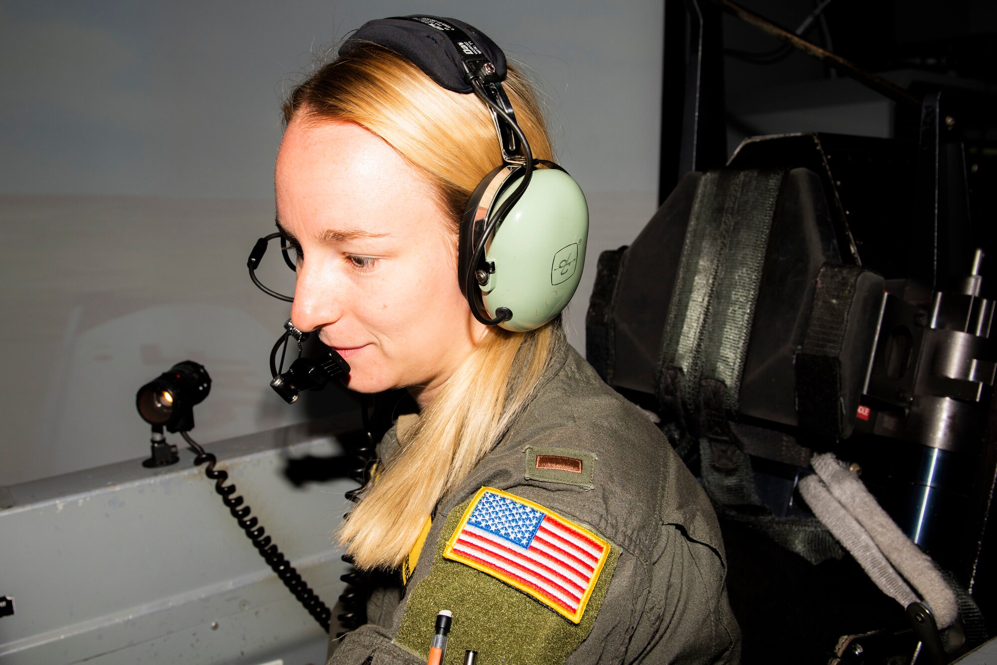 2nd Lt. Mackenzie Loewen, 47th Flying Training Wing student pilot, straps into her seat and prepares for a simulated Texan II T-6 flight at Laughlin Air Force Base, Texas on Jul. 19, 2021. The simulators are state of the art equipment that can replicate any environment or situation that they may face when piloting the aircraft. (U.S. Air Force photo by Airman 1st Class David Phaff)