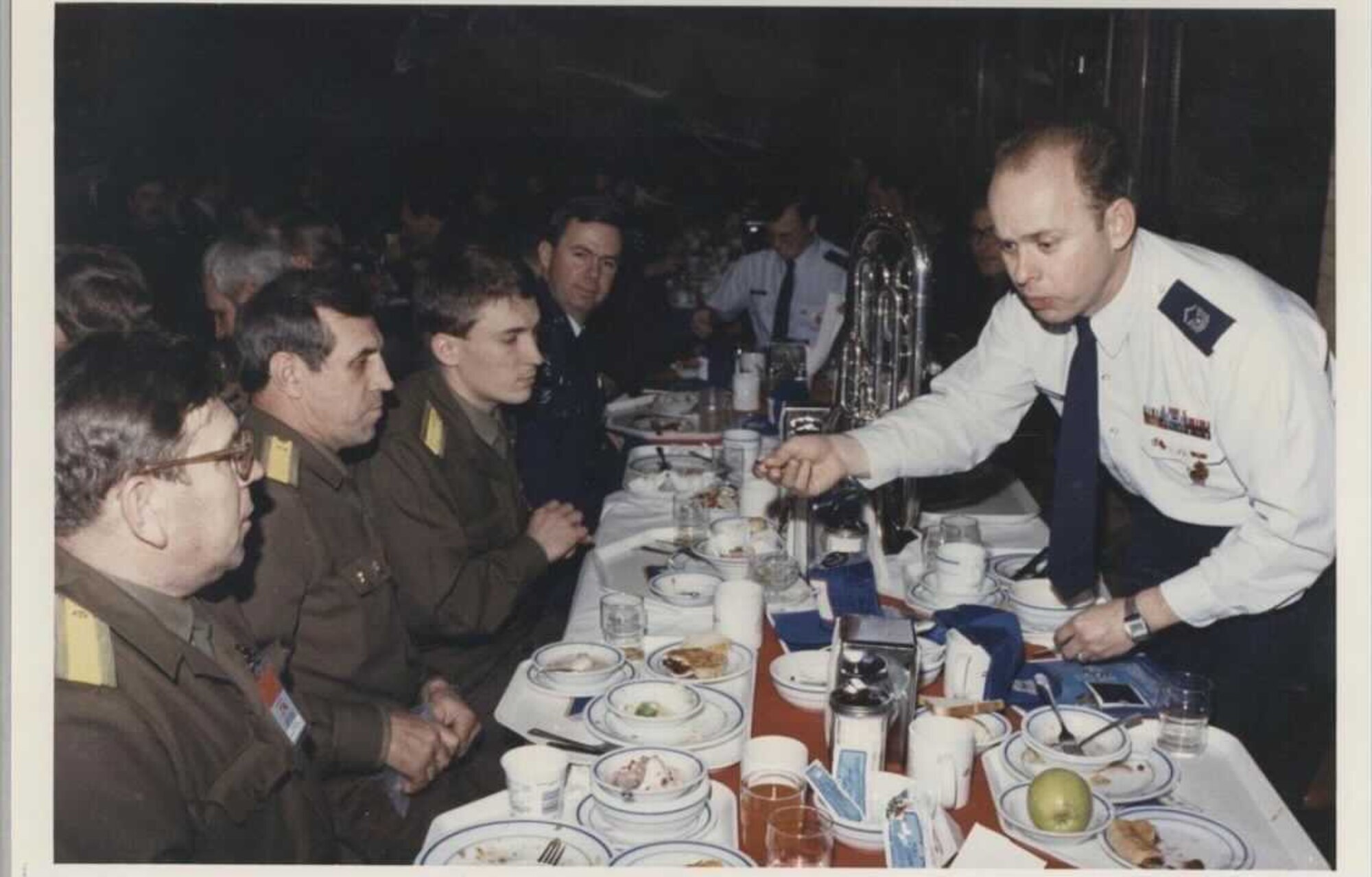 Chief Master Sergeant (ret.) Brian Bowman engages with members of a Russian military band on a Band tour of Russia.