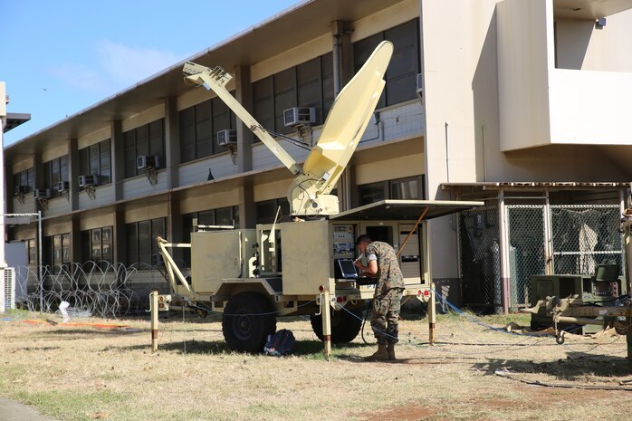 Lance Cpl Robert Murphy, a satellite operator with 3rd Marine Regiment, operates a Very Small Aperture Terminal-Large as part of exercise Island Marauder 21 aboard Marine Corps Base Hawaii, August 9, 2021. Island Marauder, a sub-component of Large Scale Exercise 21, is an annual technology demonstration that offers an opportunity to both observe mission-critical capabilities emergent Marine Corps systems afford the warfighter and solicit feedback from Subject Matter Experts and Marines who enable and use the technologies. (U.S. Marine Corps photo by Samantha Bates)