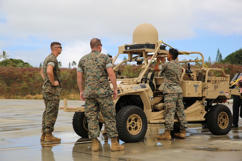 Marines prepare a Utility Task Vehicle equipped with Networking-On-The-Move Ground for transport as part of Island Marauder 2021 aboard Marine Corps Base Hawaii, August 11, 2021. Island Marauder is a subcomponent of Large Scale Exercise 21, a Joint Staff-sponsored exercise focused on integrating defense activities across the Indo-Pacific region. (U.S. Marine Corps photo by Samantha Bates)