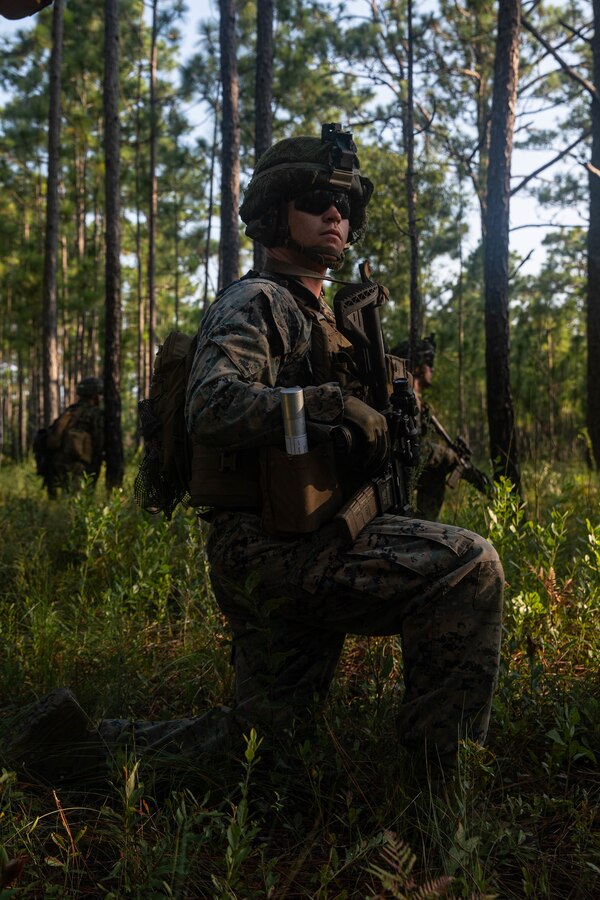 U.S. Marine Corps Cpl. William Collins, a squad leader with 3d Battalion, 2d Marine Regiment, 2d Marine Division, waits to provide support on a support-by-fire range during a field exercise on Camp Lejeune, N.C., Aug. 12, 2021.