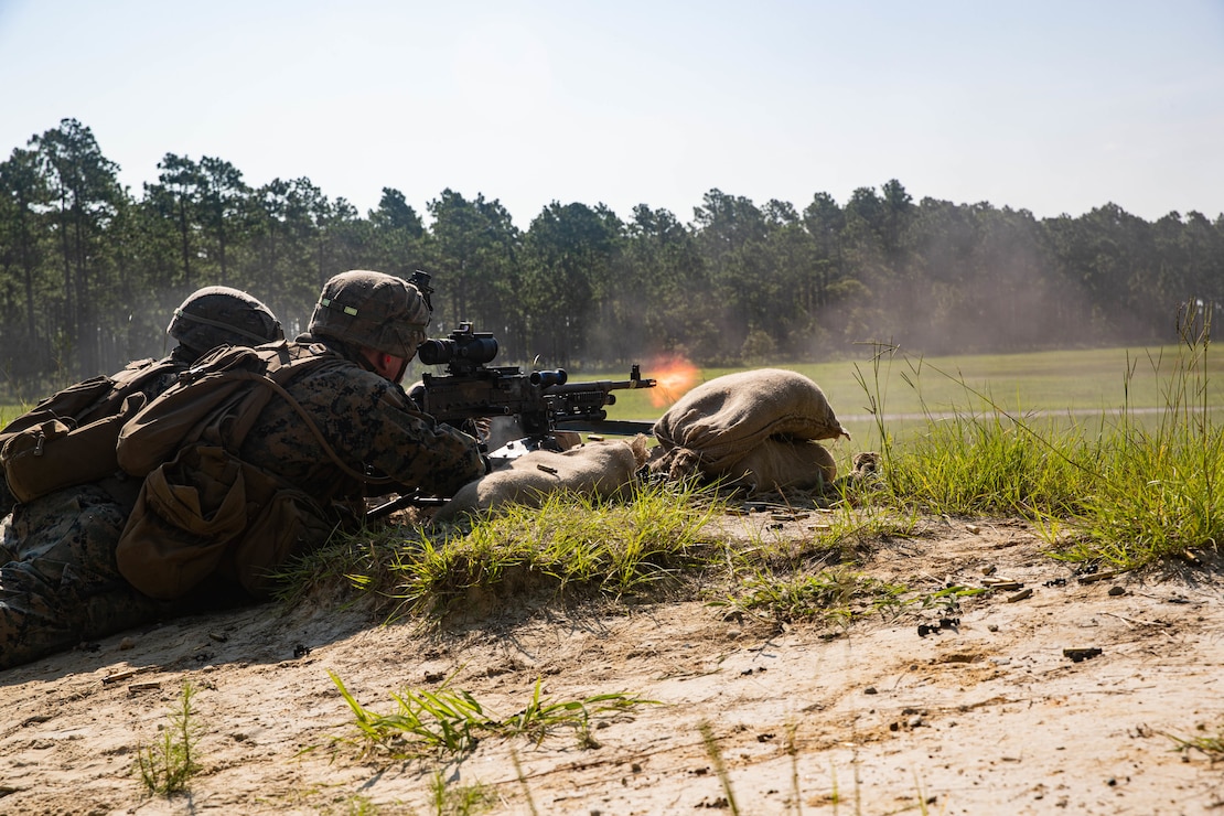U.S. Marine Corps Lance Cpl. Samal Khosravi, left, and Lance Cpl. Mathew Jude, both machine gunners with 3d Battalion, 2d Marine Regiment, 2d Marine Division, suppress notional enemies during a support-by-fire range as part of a field exercise on Camp Lejeune, N.C., Aug. 12, 2021. The focus of this exercise was to prepare for their next evolution of training as the unit works toward future deployments. (U.S. Marine Corps photo by Lance Cpl. Reine Whitaker)