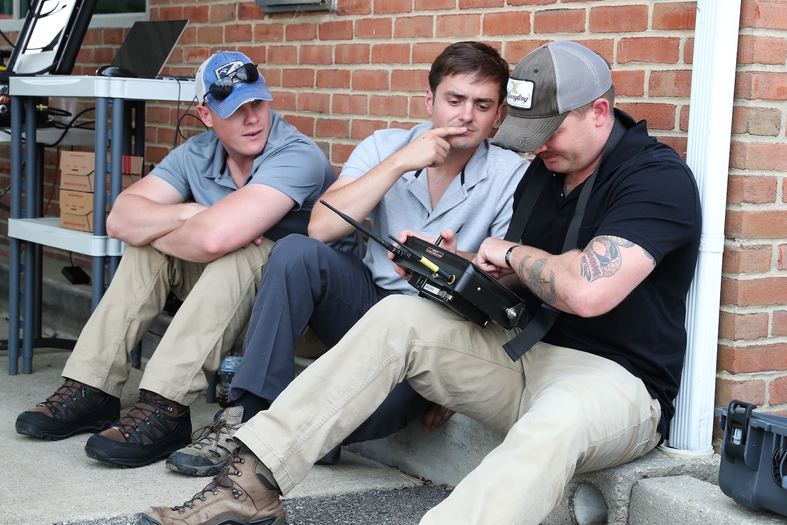 Marines from Marine Corps Base Camp Lejeune, North Carolina, operate a mini caliber robot through an abandoned building to try to locate and X-ray an improvised explosive device at the 2021 Eastern National Robot Rodeo held in Indian Head, Maryland, Aug. 2.