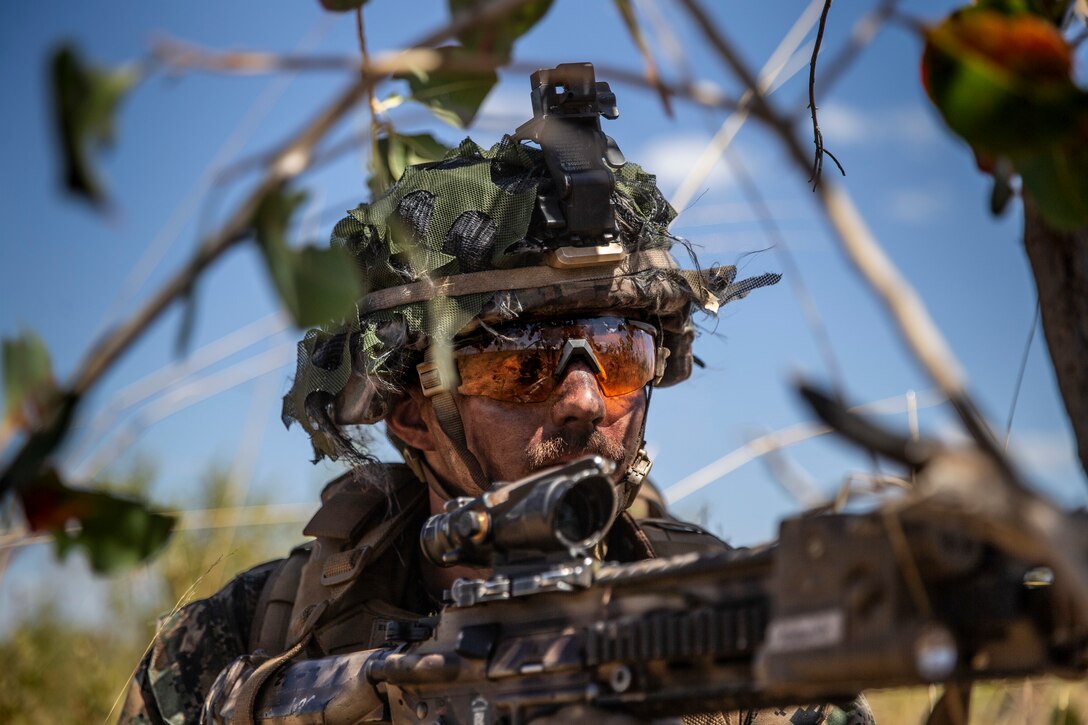 U.S. Marine Corps Sgt. Joseph Judd, a 61mm mortars section leader with Company B., 1st Battalion, 7th Marine Regiment (Reinforced), Marine Rotational Force – Darwin, provides security during an airfield seizure for Exercise Loobye at Bradshaw Field Training Area, NT, Australia, Aug. 12, 2021. B Co. began Exercise Loobye by seizing Nackeroo Airfield at Bradshaw Field Training Area, creating a secure location to conduct a High Mobility Artillery Rocket System Rapid Infiltration. Exercises like Loobye demonstrate MRF-D’s ability to conduct operations as a joint force with the ADF, execute expeditionary operations, like HIRAIN, and exemplify their mutual dedication to being postured and ready to respond to a crisis or contingency in the Indo-Pacific region.