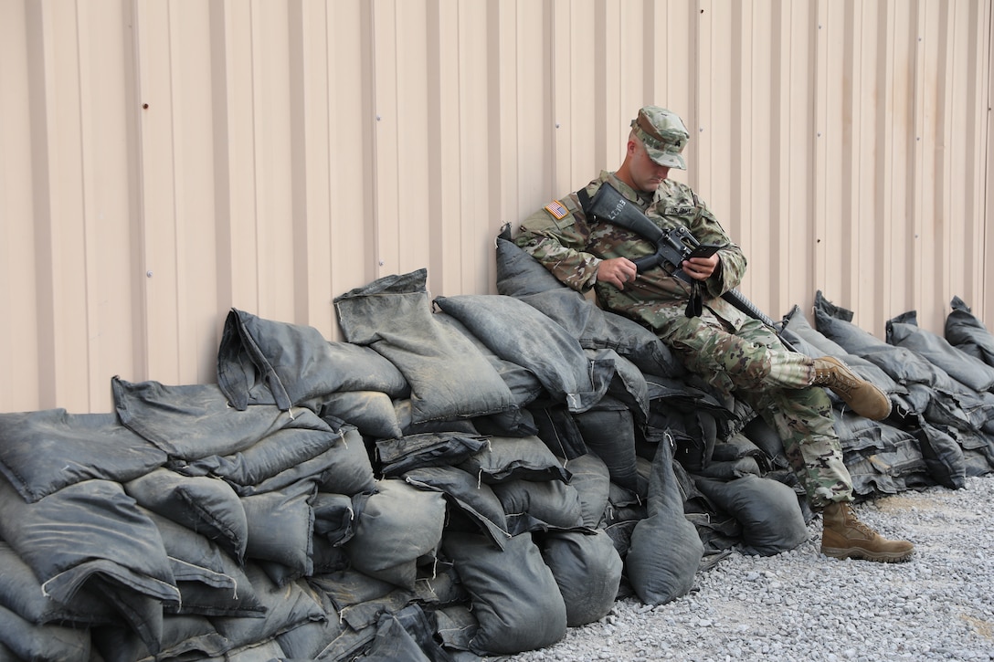 An Army Reserve Soldier assigned to Headquarters and Headquarters Detachment, 84th Training Command, takes a break during rifle marksmanship qualification held Aug. 7, 2021, at Camby Hill Range in Fort Knox, Kentucky. (U.S. Army photo by Sgt. 1st Class Osvaldo P. Sanchez)